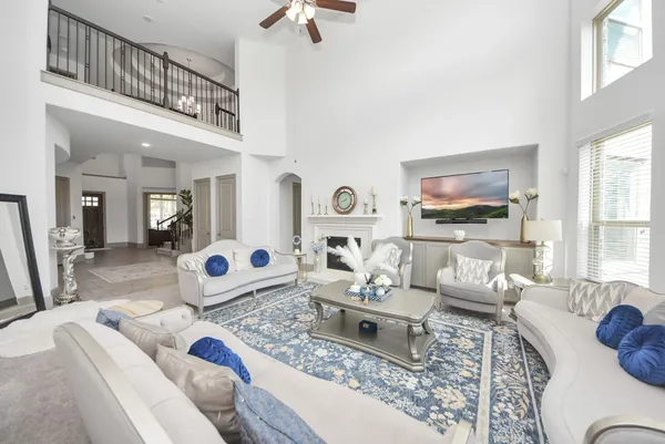 a living room with furniture and a flat screen tv