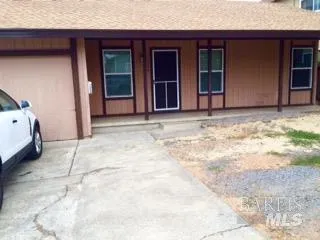 a view of garage with wooden floor and cabinet