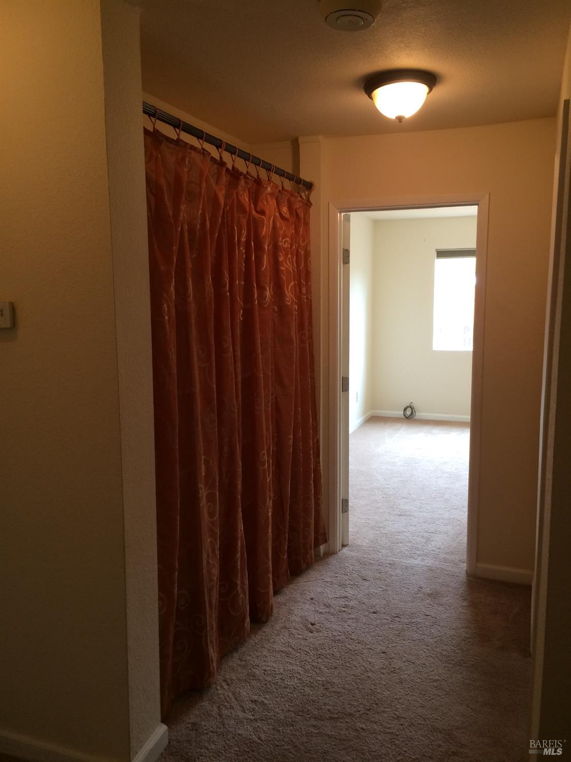 1222 Jacky Drive Santa Rosa, CA 95405 - Photo 15 of 21 a view of a hallway with wooden shelves