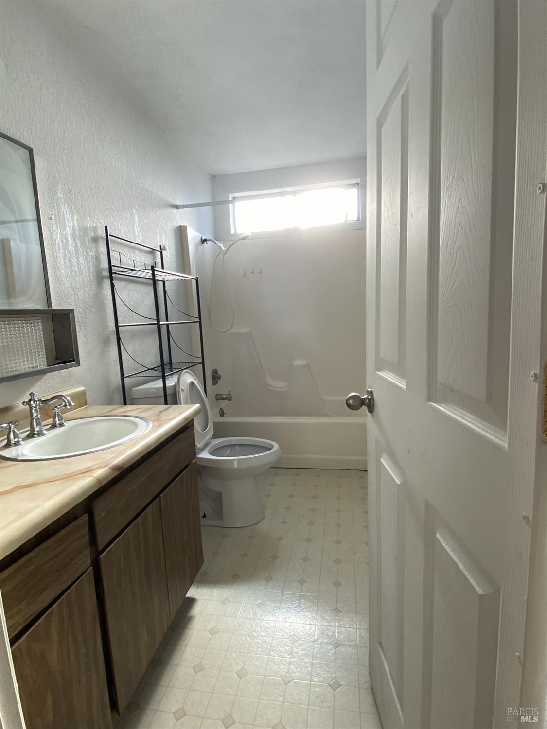 1222 Jacky Drive Santa Rosa, CA 95405 - Photo 6 of 21 a bathroom with a double vanity sink toilet and mirror