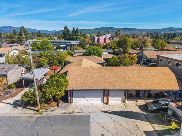 a terrace with outdoor seating and city view