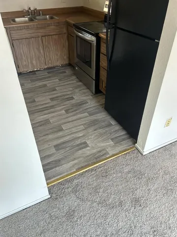a view of a kitchen from the hallway