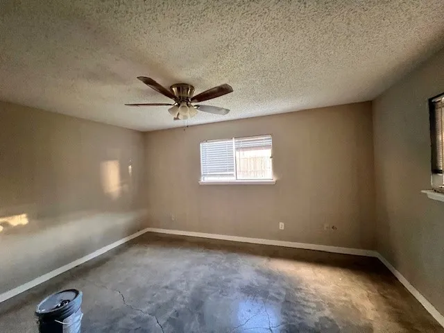 wooden floor and window in an empty room