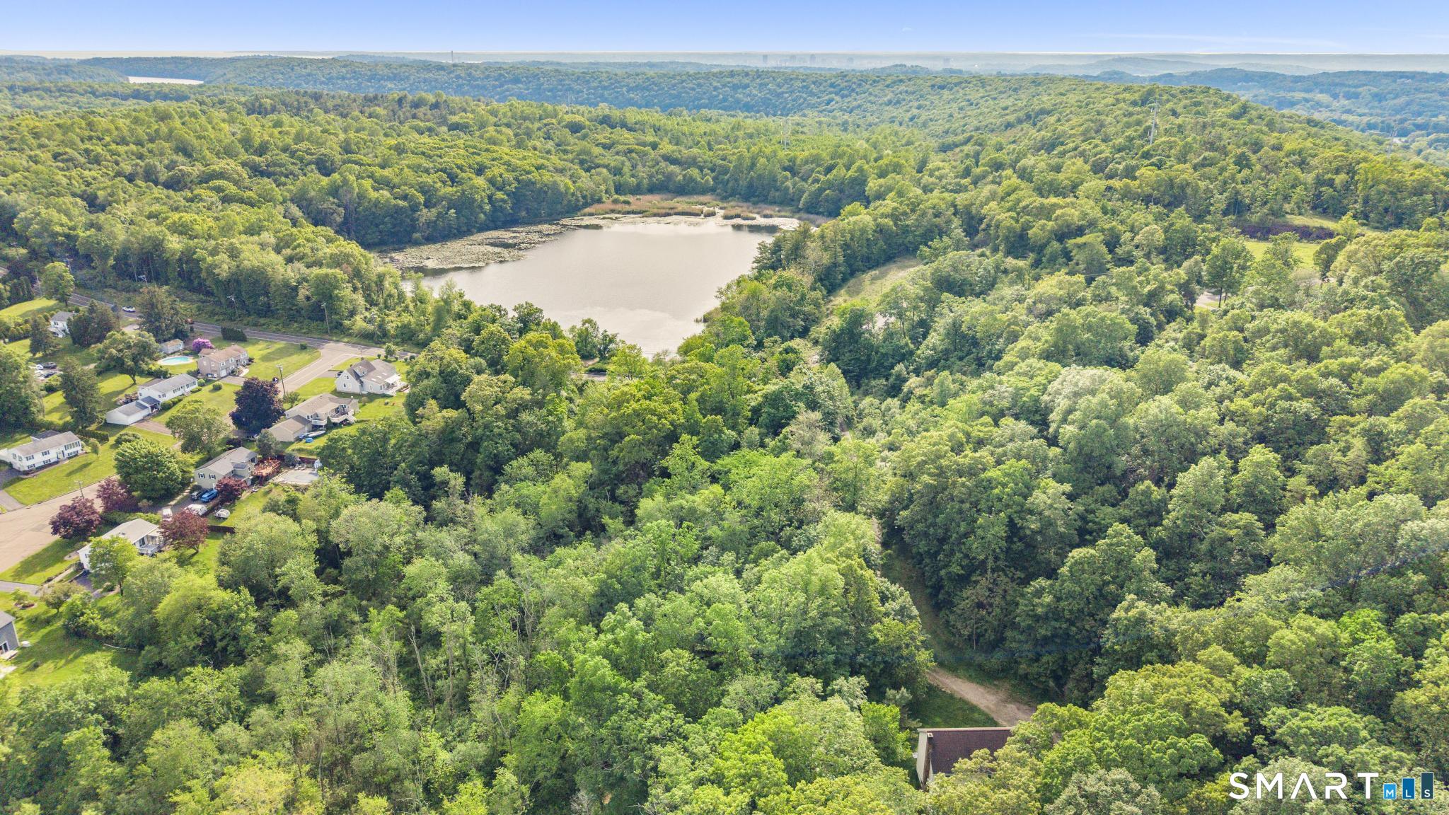 379 Brushy Plain Road Branford, CT 06405 - Photo 8 of 23 a view of a lake with a mountain in the background