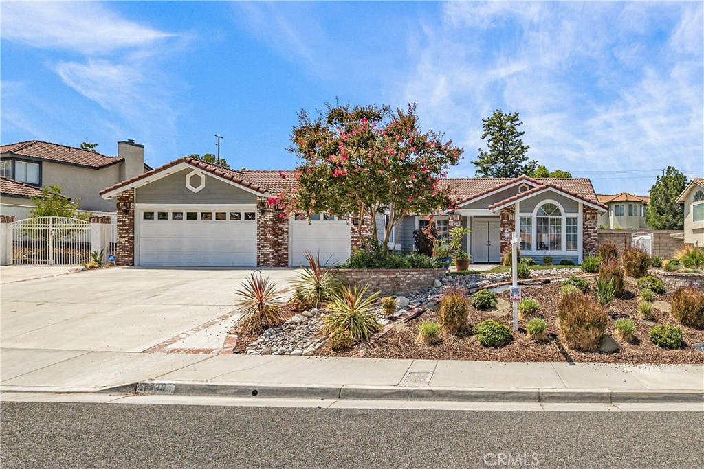 6829 Mission Grove Riverside, CA 92506 - Photo 1 of 1 a front view of a house with a garden