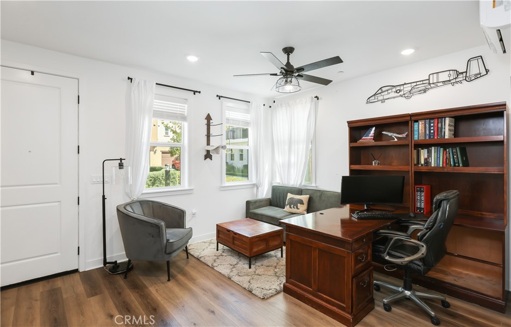 2317 West Broadway, Unit 96 Anaheim, CA 92804 - Photo 18 of 52 a view of a workspace with furniture and a window