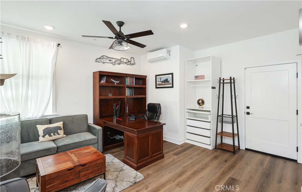 2317 West Broadway, Unit 96 Anaheim, CA 92804 - Photo 19 of 52 a living room with furniture and wooden floor