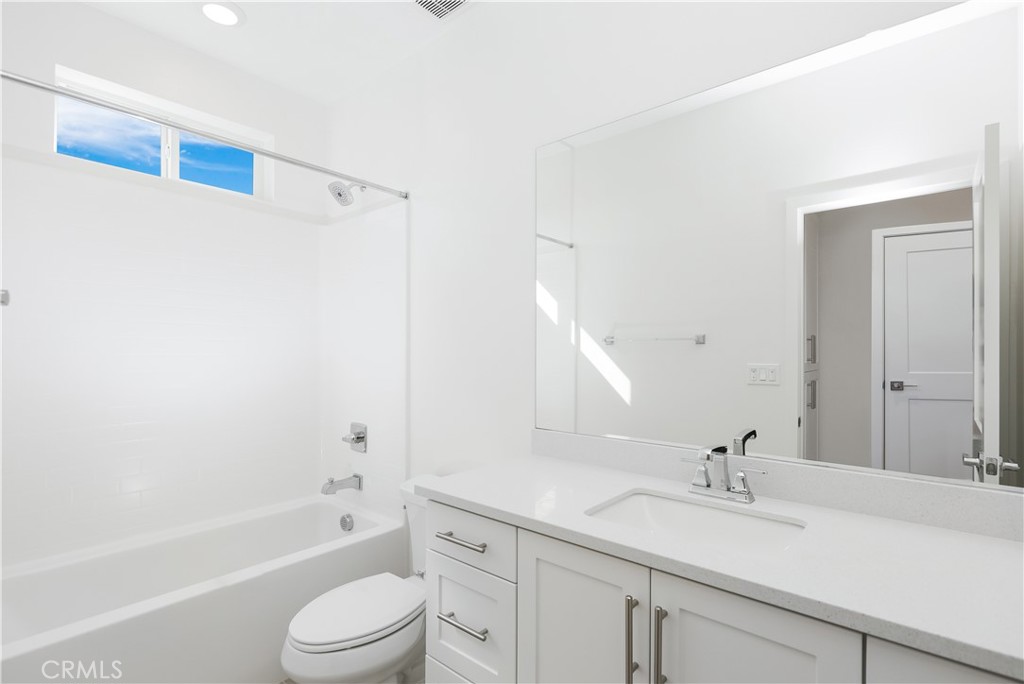 2317 West Broadway, Unit 96 Anaheim, CA 92804 - Photo 26 of 52 a bathroom with a sink a toilet and shower