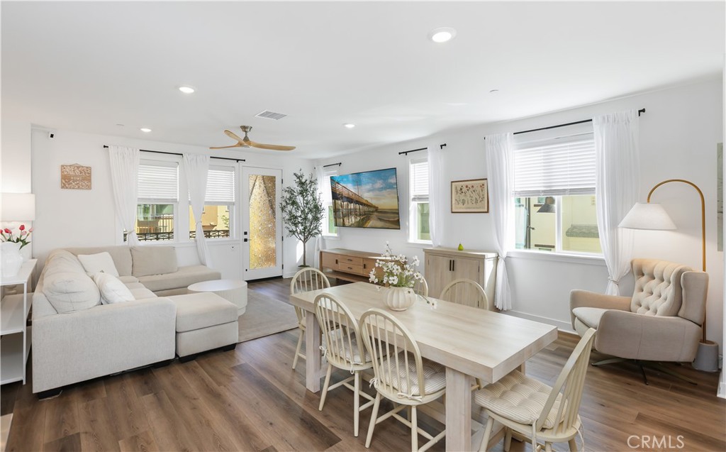 2317 West Broadway, Unit 96 Anaheim, CA 92804 - Photo 3 of 52 a living room with furniture and wooden floor