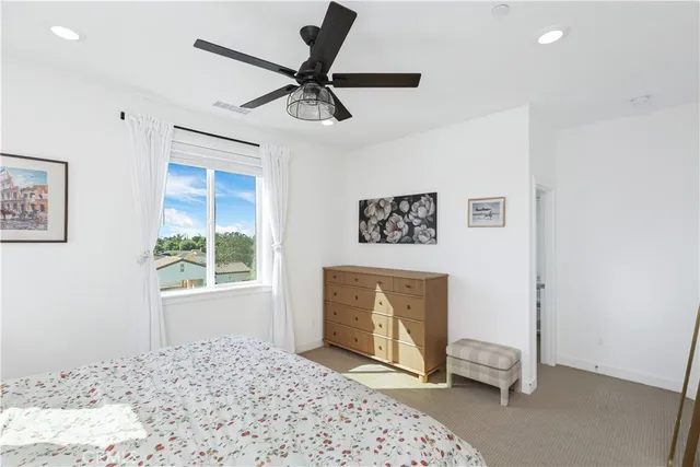 a bedroom with a bed and a dresser