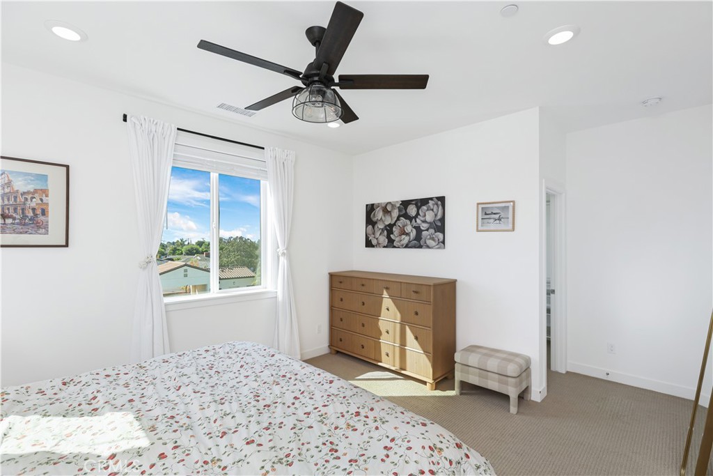 2317 West Broadway, Unit 96 Anaheim, CA 92804 - Photo 32 of 52 a bedroom with a bed and a window