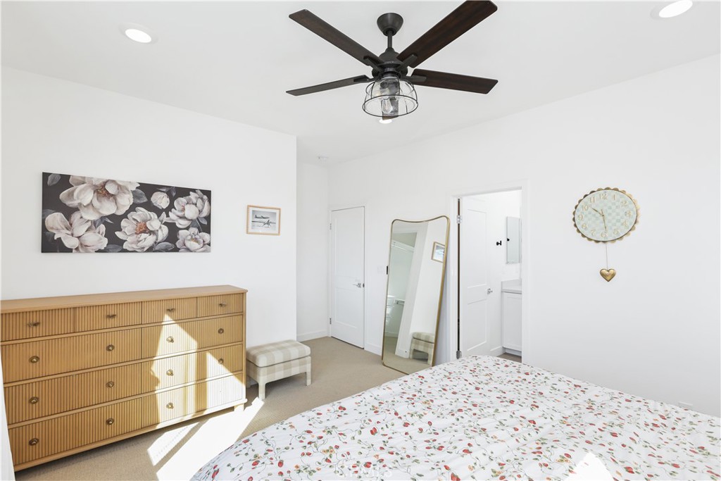 2317 West Broadway, Unit 96 Anaheim, CA 92804 - Photo 33 of 52 a bedroom with a bed and a dresser