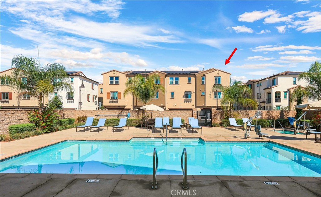 2317 West Broadway, Unit 96 Anaheim, CA 92804 - Photo 39 of 52 a view of a building with a swimming pool