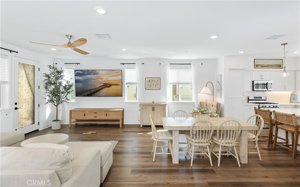 2317 West Broadway, Unit 96 Anaheim, CA 92804 - Photo 4 of 52 a living room with furniture and a flat screen tv