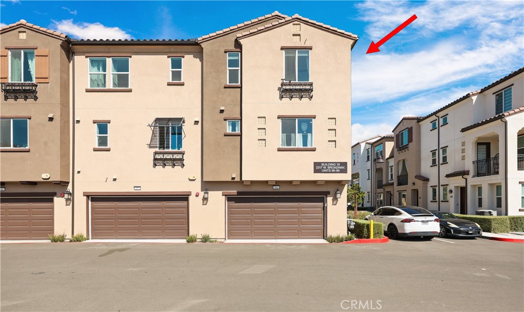 2317 West Broadway, Unit 96 Anaheim, CA 92804 - Photo 44 of 52 a view of a street with cars