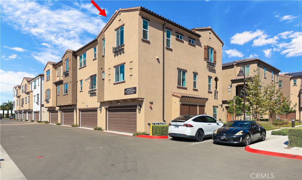 2317 West Broadway, Unit 96 Anaheim, CA 92804 - Photo 45 of 52 a car parked in front of a building