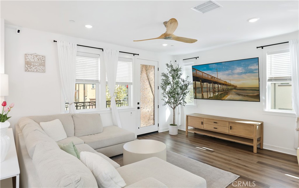 2317 West Broadway, Unit 96 Anaheim, CA 92804 - Photo 5 of 52 a living room with furniture and a flat screen tv
