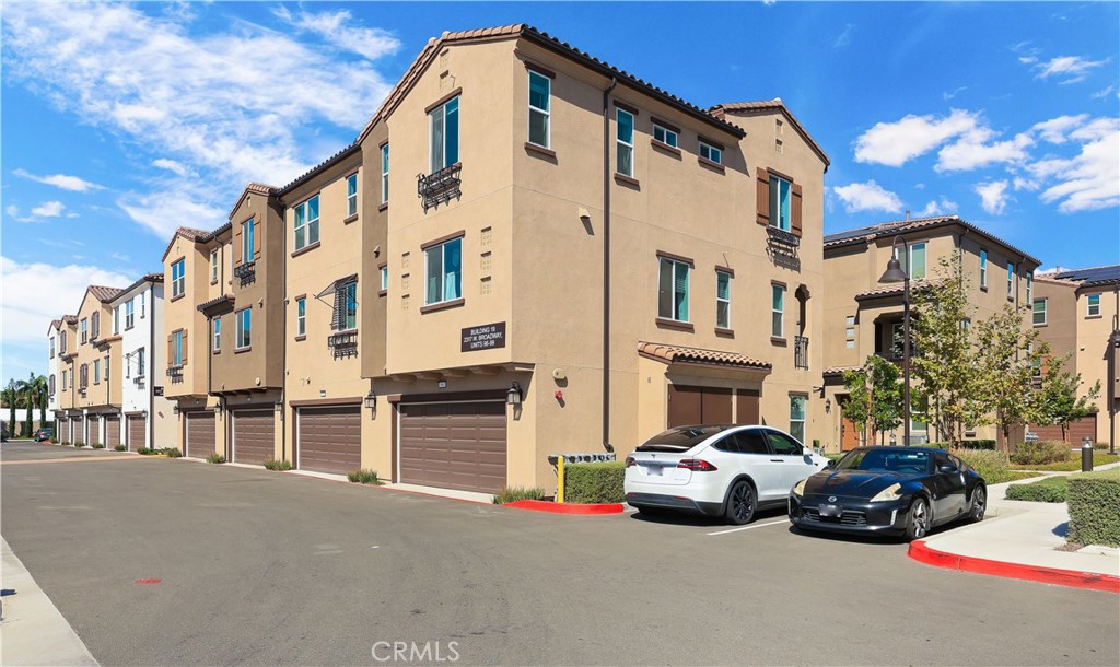 2317 West Broadway, Unit 96 Anaheim, CA 92804 - Photo 52 of 52 a car parked in front of a building