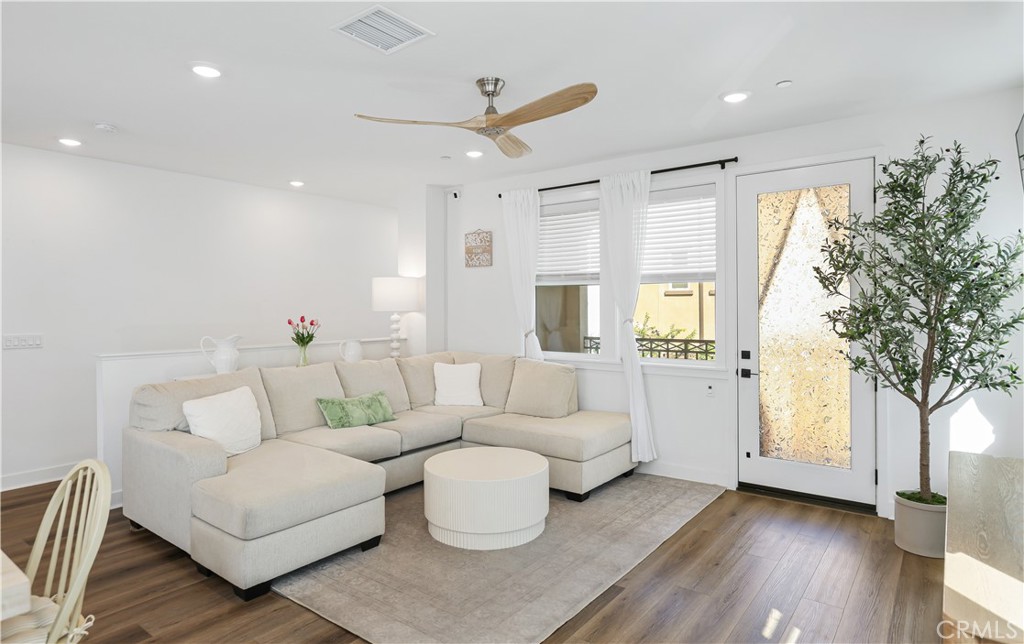 2317 West Broadway, Unit 96 Anaheim, CA 92804 - Photo 6 of 52 a living room with furniture and a large window