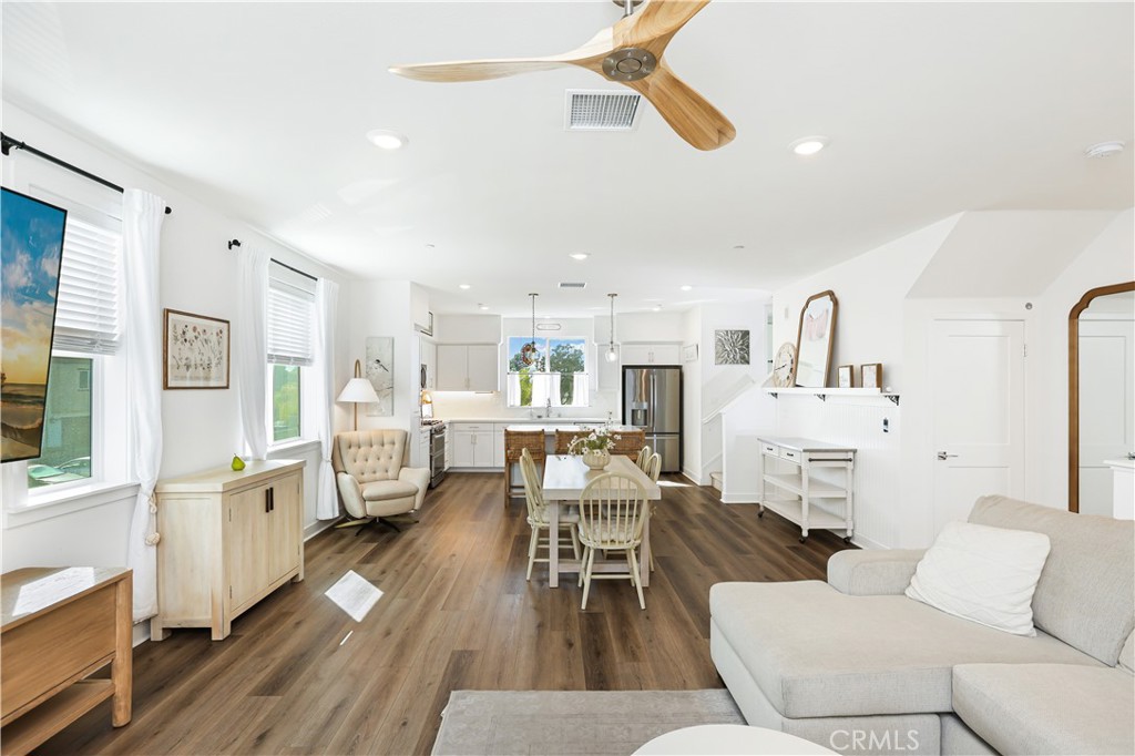 2317 West Broadway, Unit 96 Anaheim, CA 92804 - Photo 7 of 52 a living room with furniture and a wooden floor