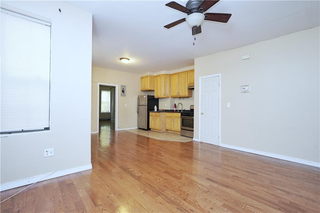 587 Van Siclen Avenue Brooklyn, NY 11207 - Photo 12 of 34 a view of empty room with wooden floor and window
