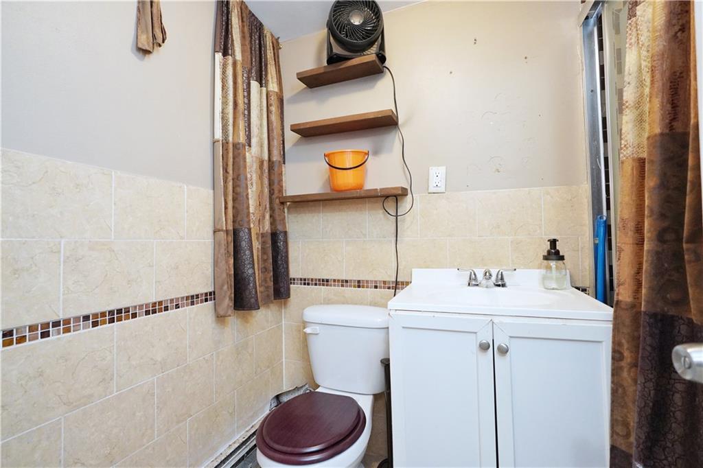 587 Van Siclen Avenue Brooklyn, NY 11207 - Photo 30 of 34 a utility room with dryer and washer