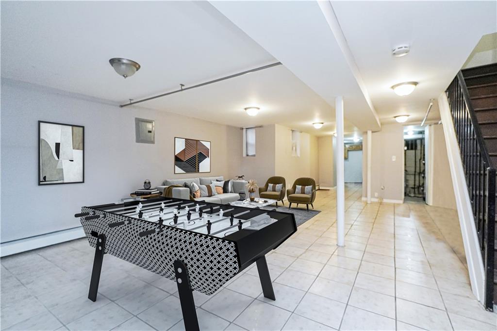 587 Van Siclen Avenue Brooklyn, NY 11207 - Photo 31 of 34 a living room with furniture