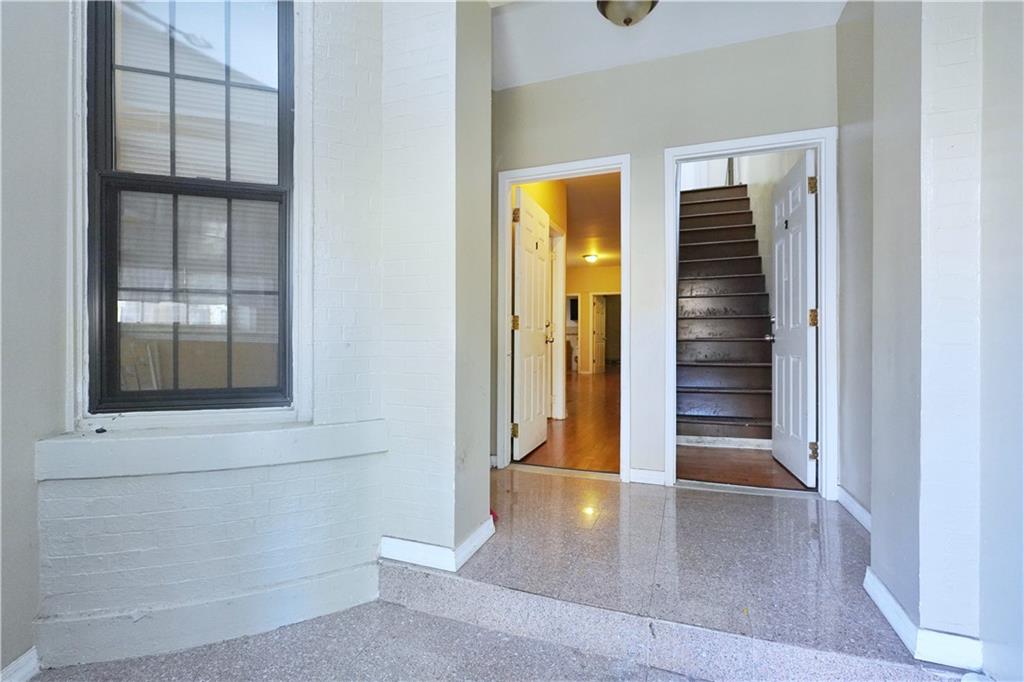 587 Van Siclen Avenue Brooklyn, NY 11207 - Photo 5 of 34 wooden floor and window in a room
