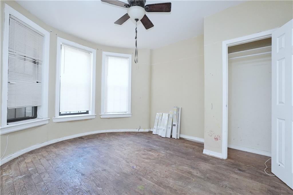 587 Van Siclen Avenue Brooklyn, NY 11207 - Photo 8 of 34 a view of an empty room with a window