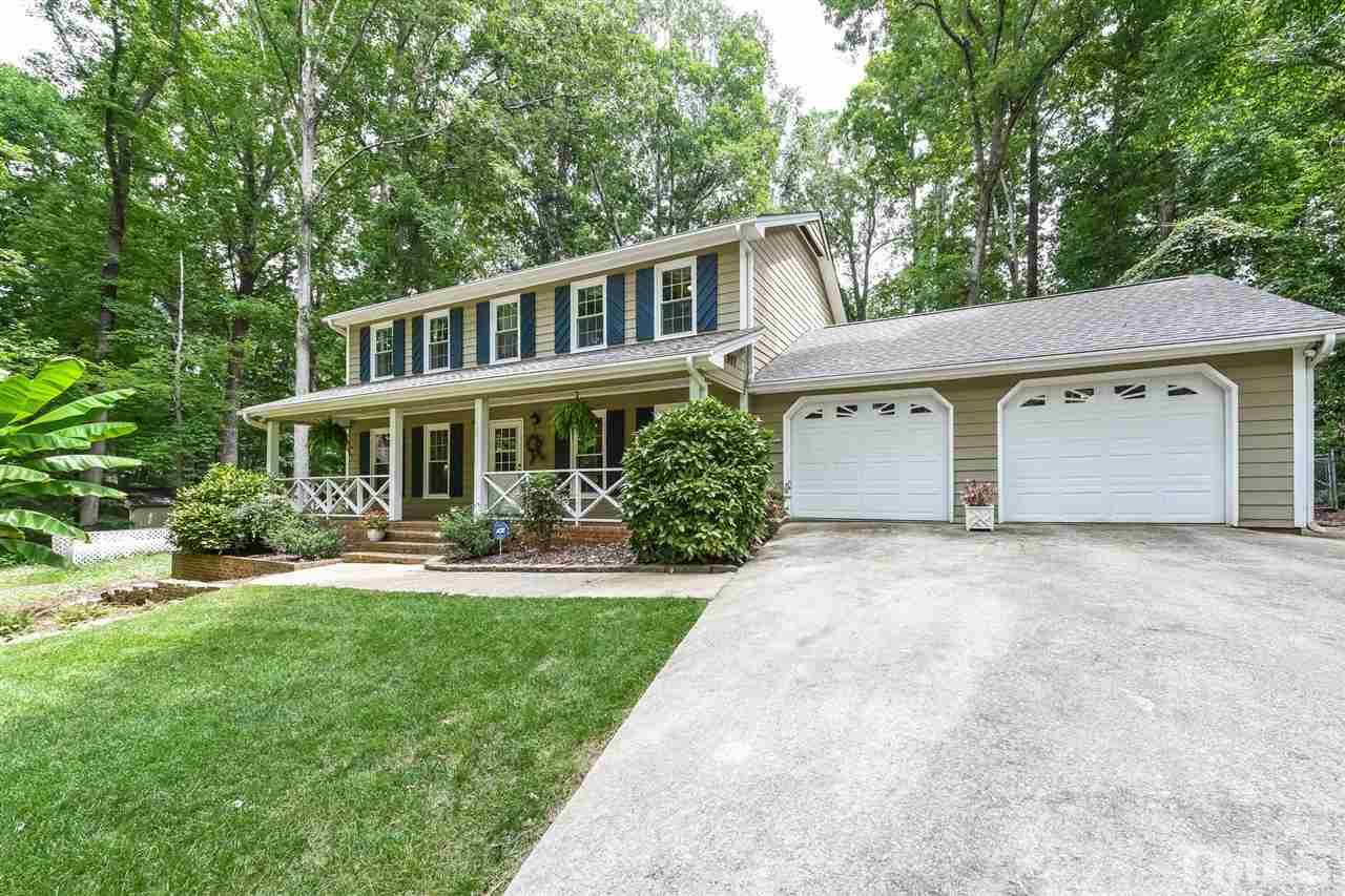 9716 Rock Creek Road Raleigh, NC 27613 - Photo 1 of 25 a front view of a house with a yard and porch