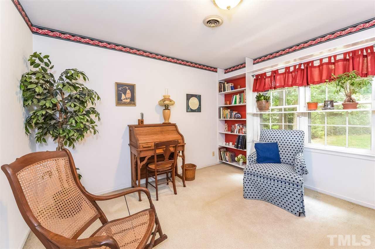 9716 Rock Creek Road Raleigh, NC 27613 - Photo 20 of 25 a living room with furniture and a large window