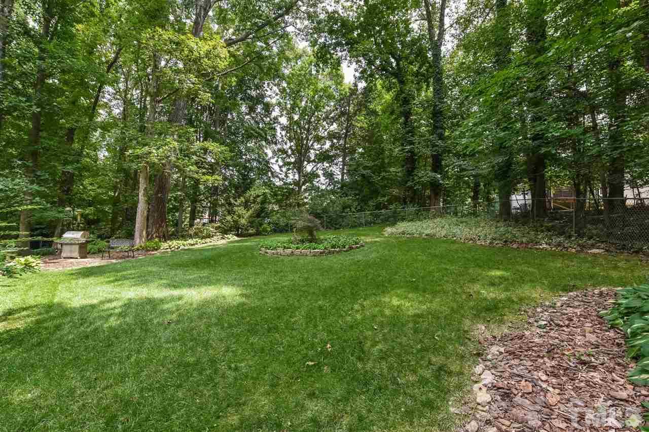 9716 Rock Creek Road Raleigh, NC 27613 - Photo 25 of 25 a view of a tree in a yard