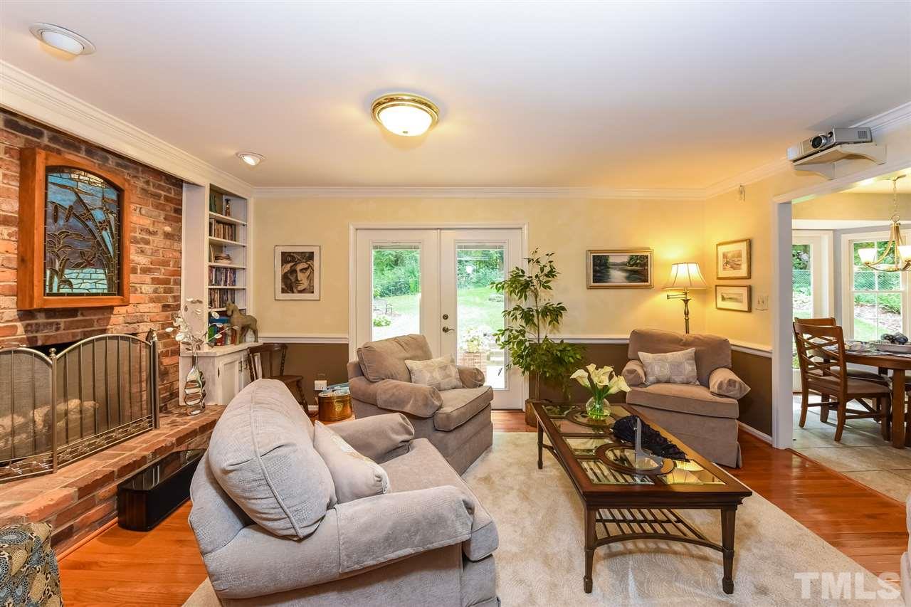 9716 Rock Creek Road Raleigh, NC 27613 - Photo 10 of 25 a living room with furniture and a large window