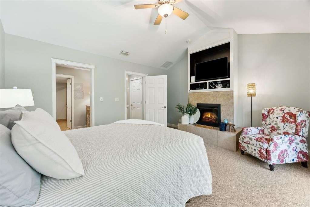 3033 Sea Marsh Road Fernandina Beach, FL 32034 - Photo 8 of 37 a spacious bedroom with a bed and a television