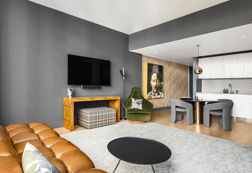 1 Wall Street, Unit 710 Manhattan, NY 10005 - Photo 3 of 19 a living room with furniture and a fireplace