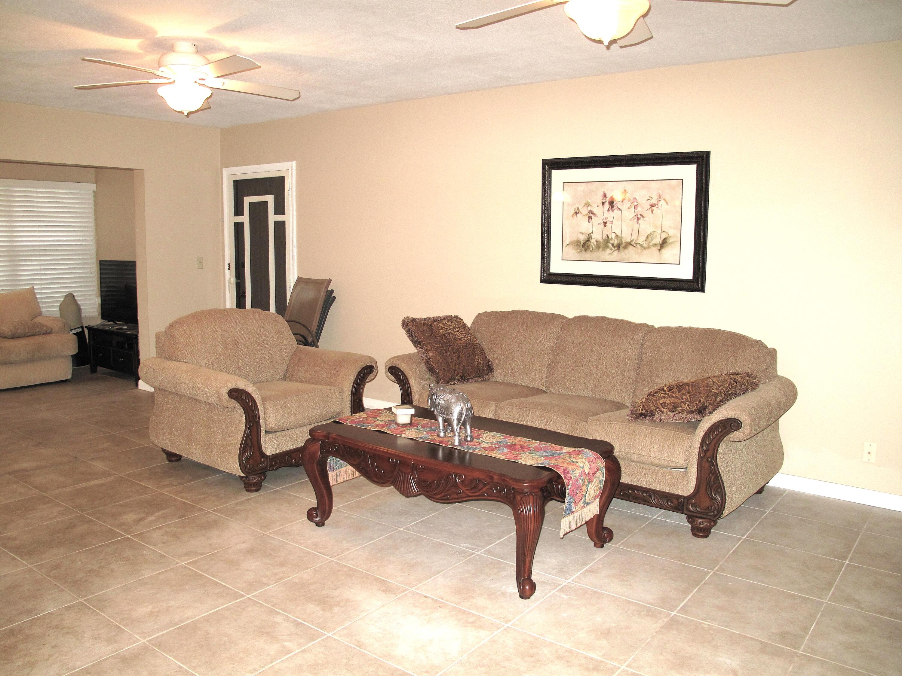 1315 High Point Way Southeast, Unit B Delray Beach, FL 33445 - Photo 12 of 41 a living room with furniture and a couch
