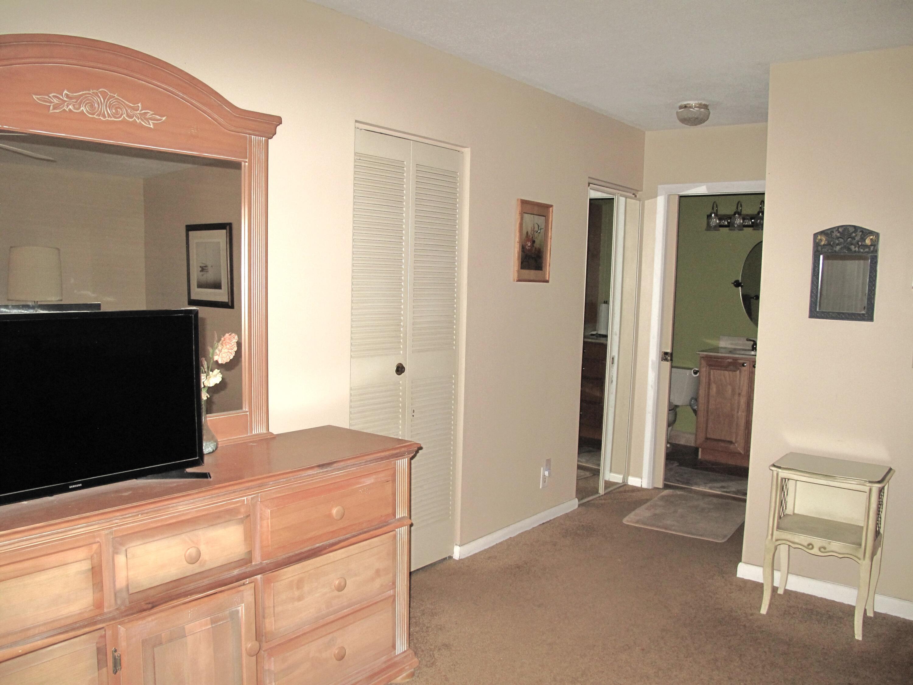 1315 High Point Way Southeast, Unit B Delray Beach, FL 33445 - Photo 16 of 41 a view of kitchen with cabinets and wooden floor
