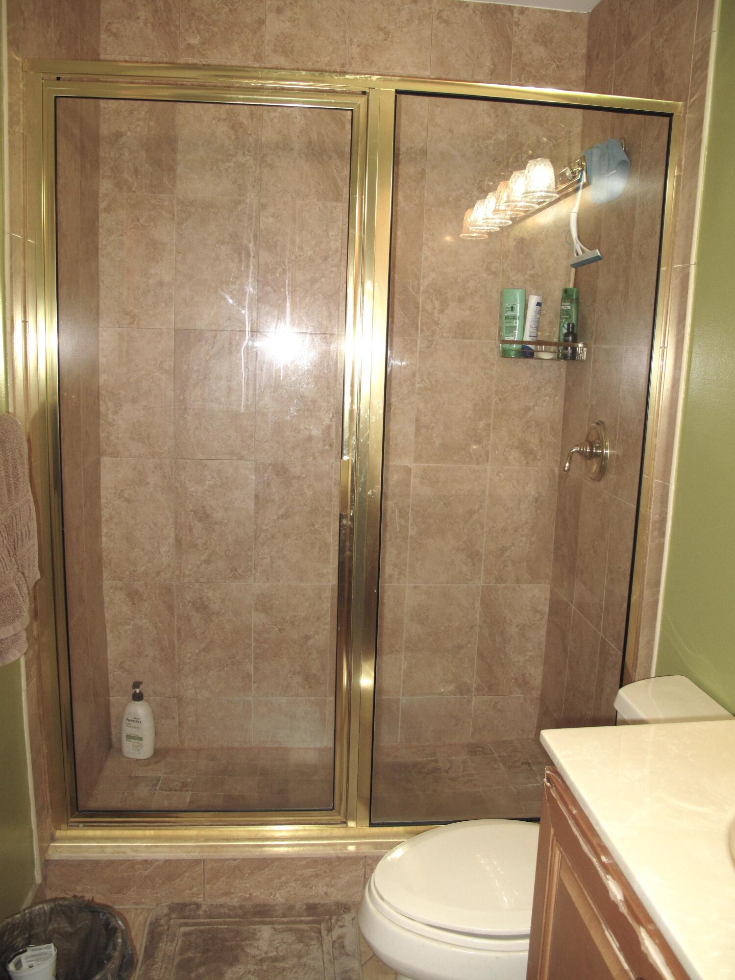 1315 High Point Way Southeast, Unit B Delray Beach, FL 33445 - Photo 20 of 41 a bathroom with a shower and a toilet