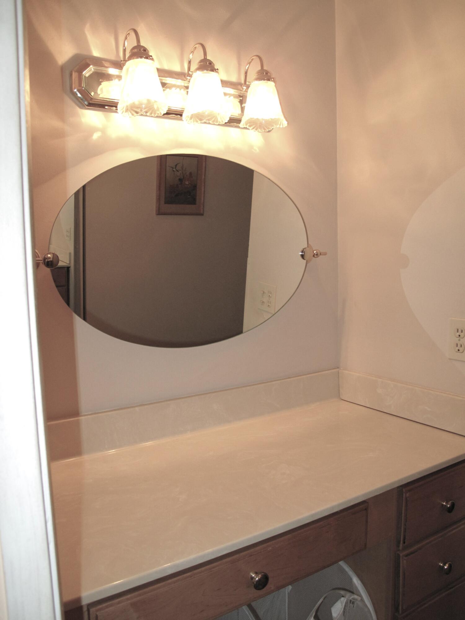 1315 High Point Way Southeast, Unit B Delray Beach, FL 33445 - Photo 21 of 41 a view of storage and utility room with a sink