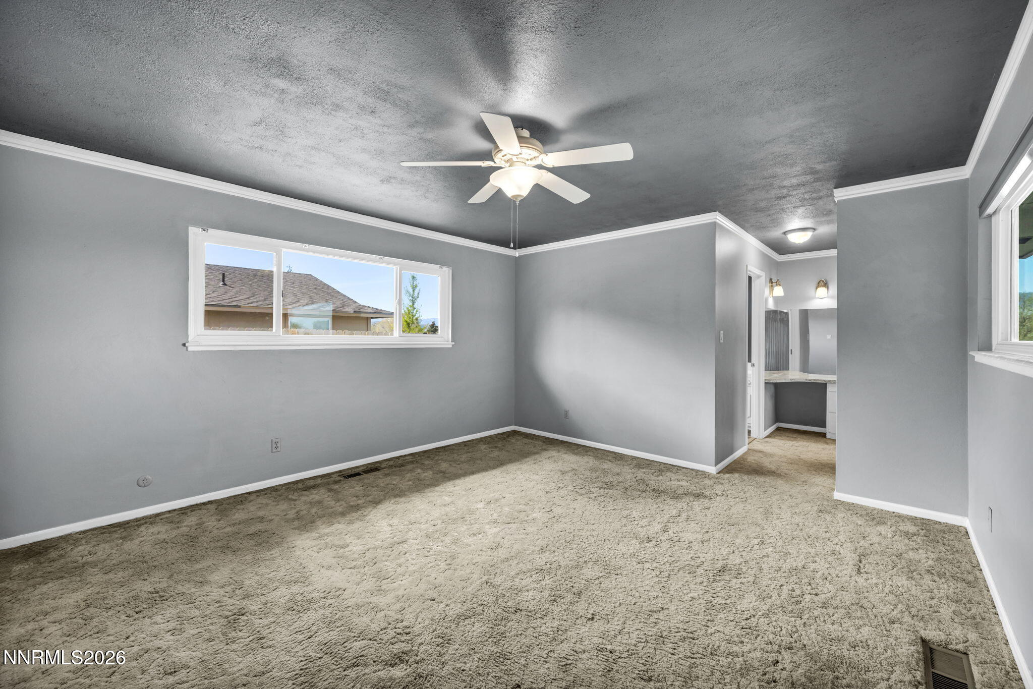 14190 Rim Rock Drive Reno, NV 89521 - Photo 28 of 68 a view of an empty room with a ceiling fan