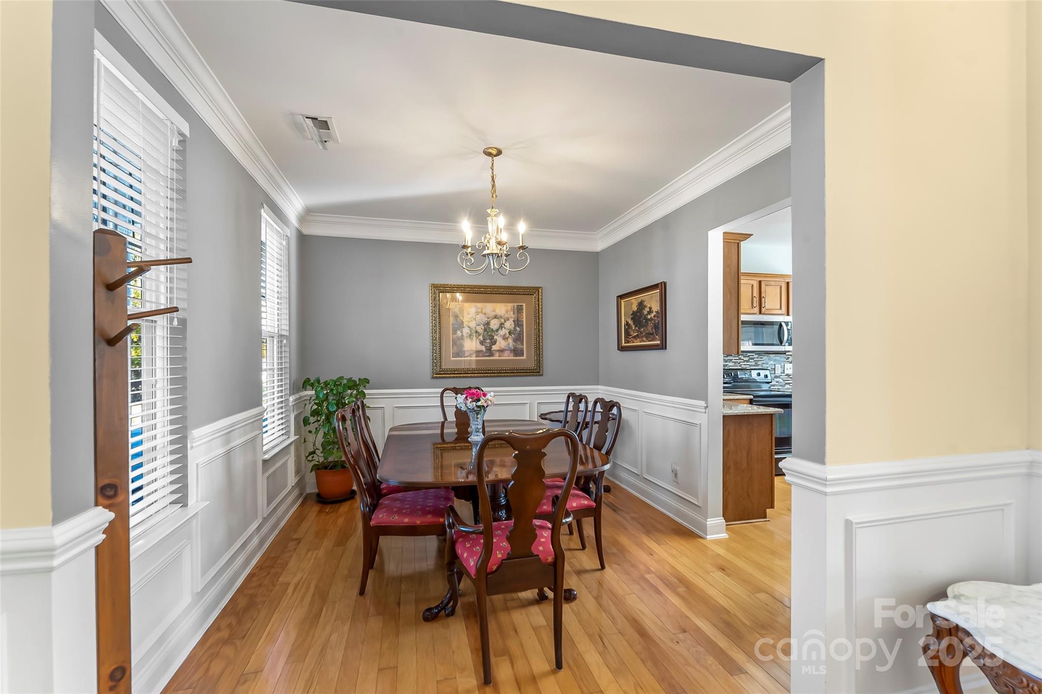 1450 Jc Raulston Court Hickory, NC 28602 - Photo 12 of 35 a view of a dining room with furniture window and wooden floor