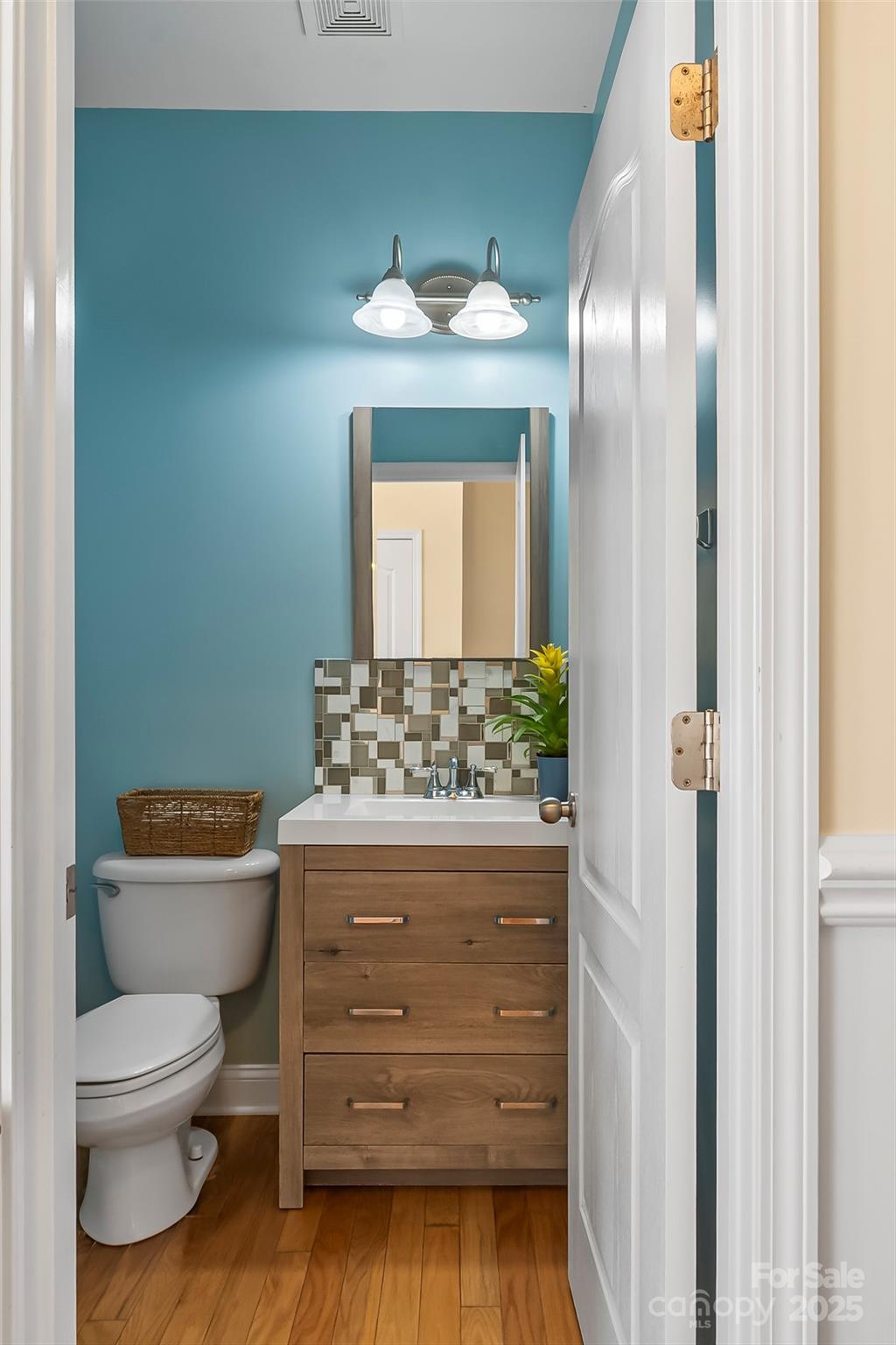1450 Jc Raulston Court Hickory, NC 28602 - Photo 13 of 35 a bathroom with a toilet sink and mirror