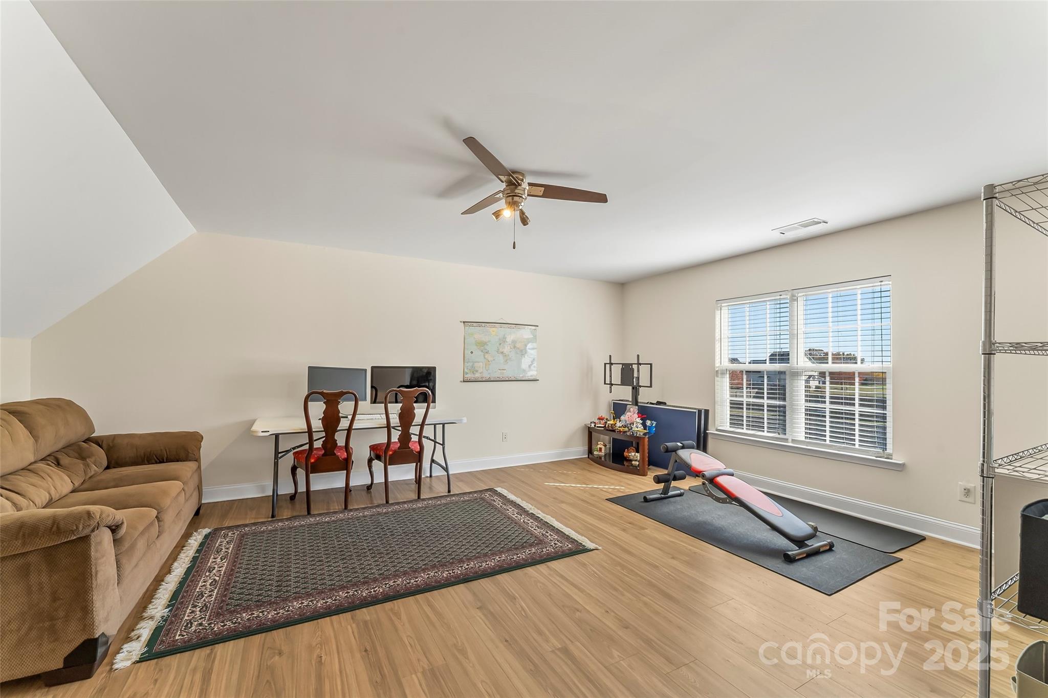 1450 Jc Raulston Court Hickory, NC 28602 - Photo 23 of 35 a living room with furniture gym equipment and a large window
