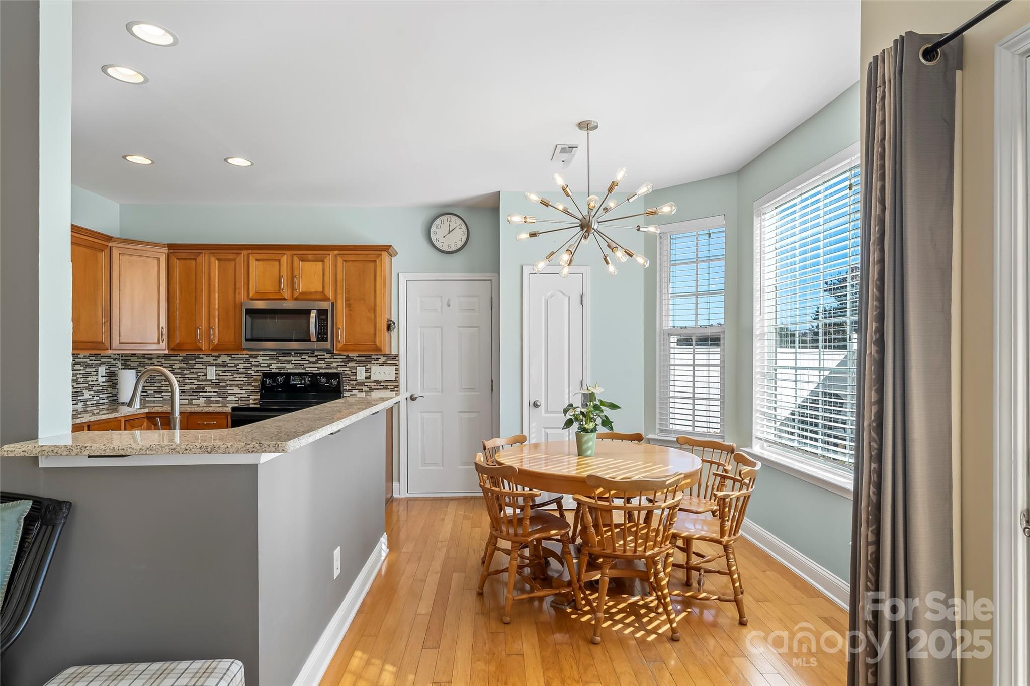 1450 Jc Raulston Court Hickory, NC 28602 - Photo 8 of 35 a view of a dining room with furniture window and outside view