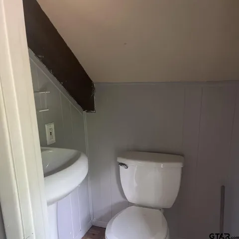 a bathroom with a toilet and a sink