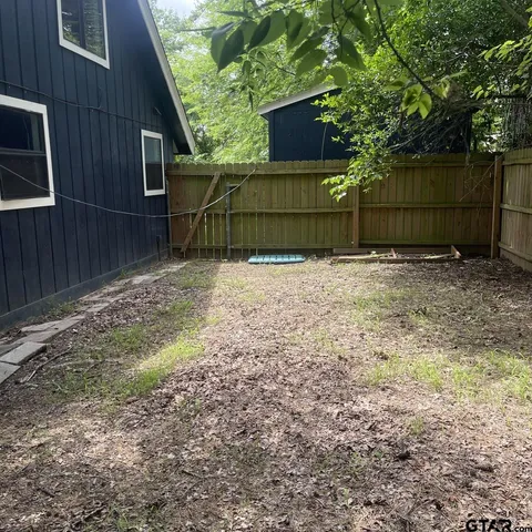 a backyard of a house with lots of green space