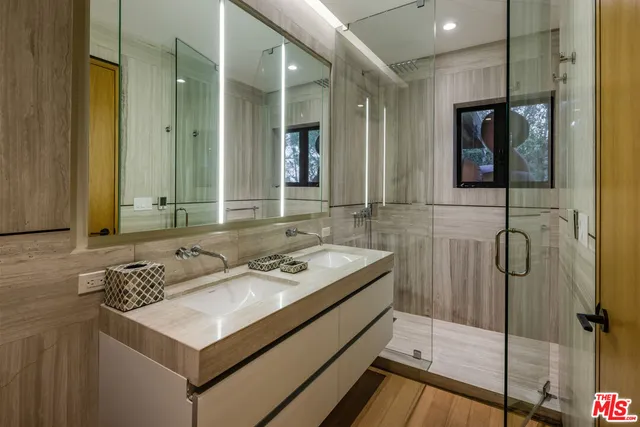 a bathroom with a sink and mirror