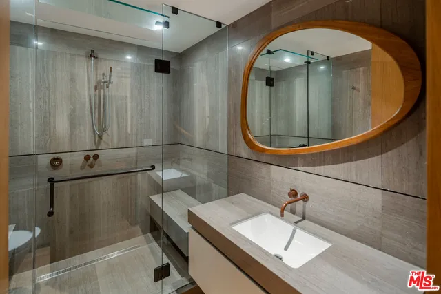 a bathroom with a sink and a mirror