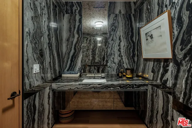 a bedroom with a bed and a fireplace