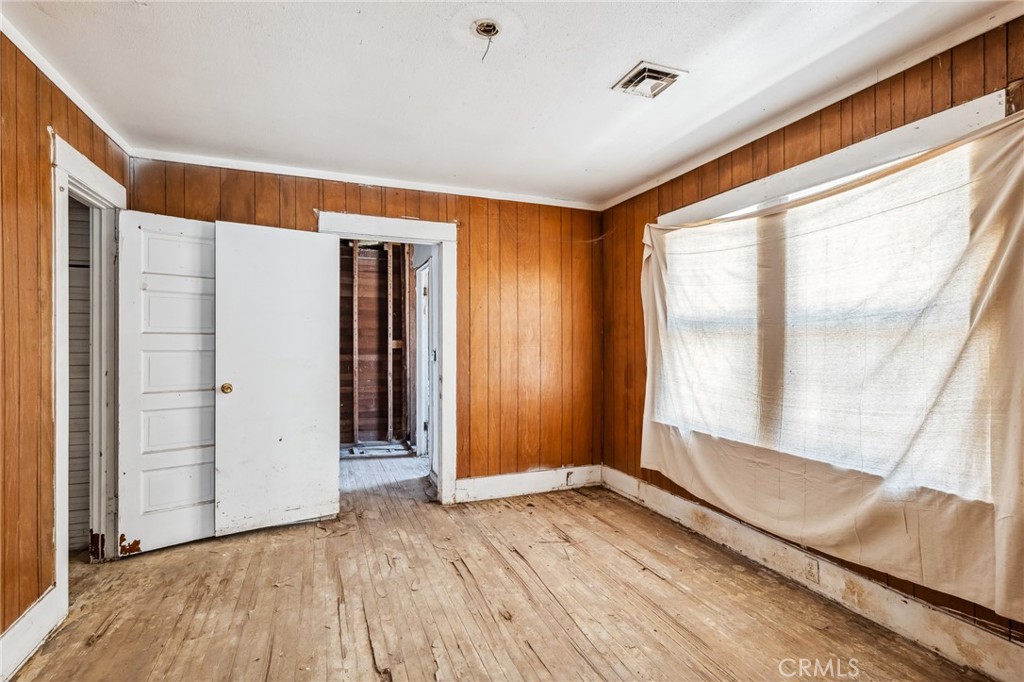 518 A Street Needles, CA 92363 - Photo 13 of 49 wooden floor in an empty room with a window